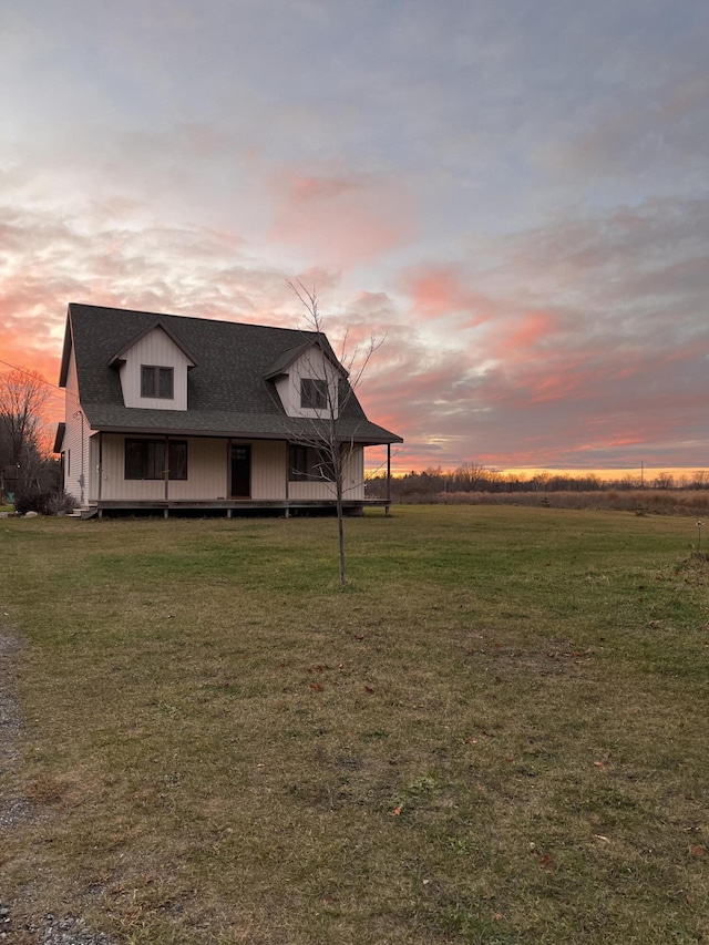 country-style home with a lawn