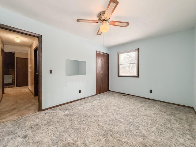 unfurnished bedroom with light carpet and ceiling fan