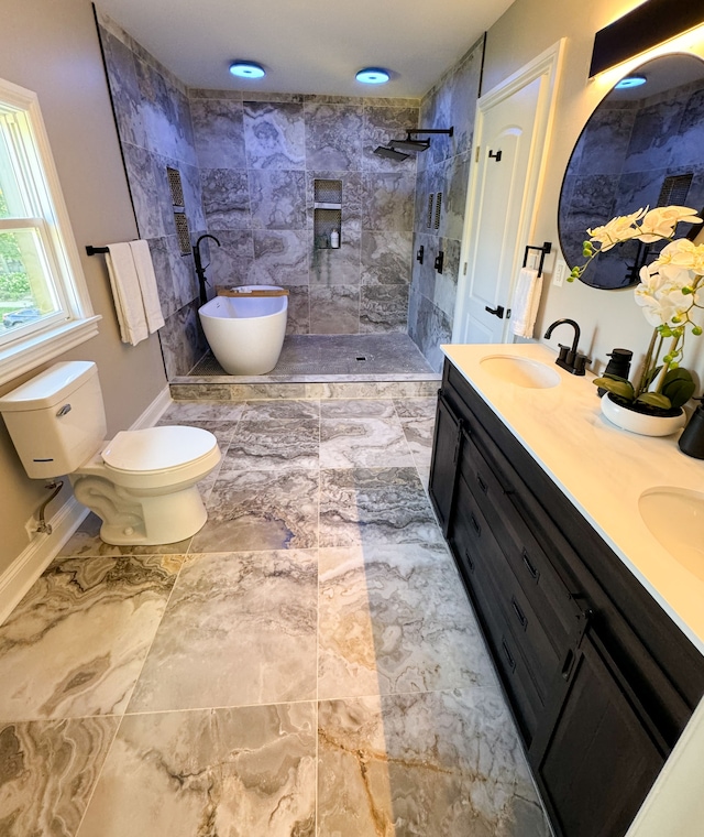 full bathroom featuring vanity, toilet, and shower with separate bathtub