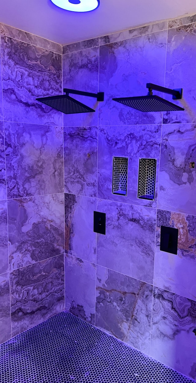 interior space featuring tiled shower