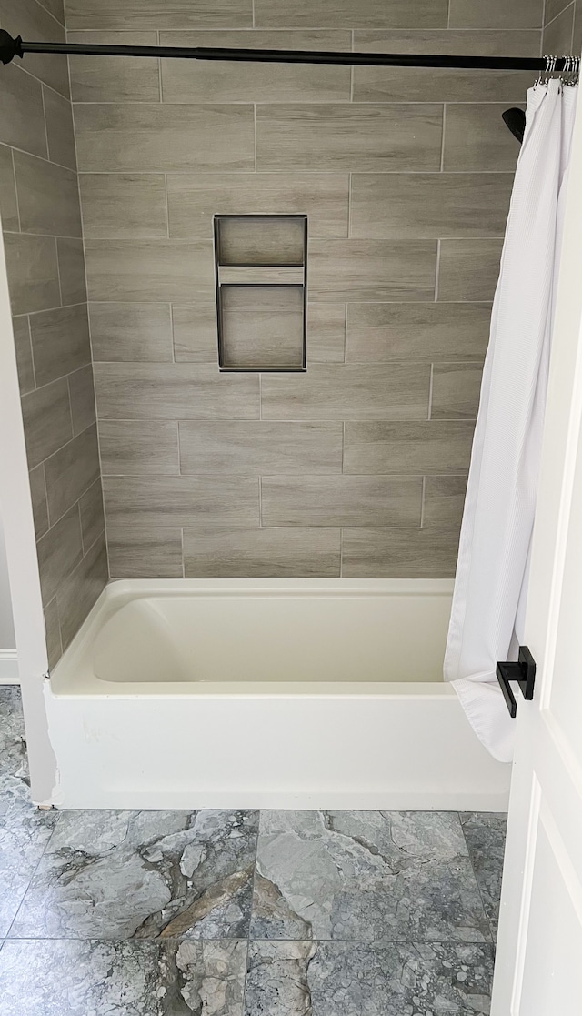 bathroom featuring shower / tub combo