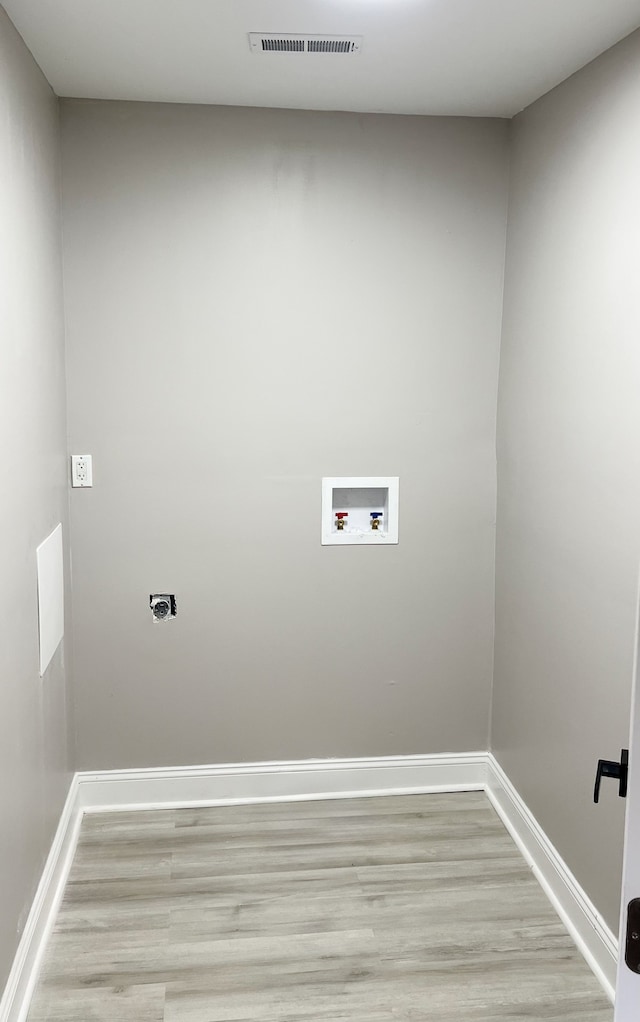 laundry room featuring hookup for an electric dryer, washer hookup, and light wood-type flooring