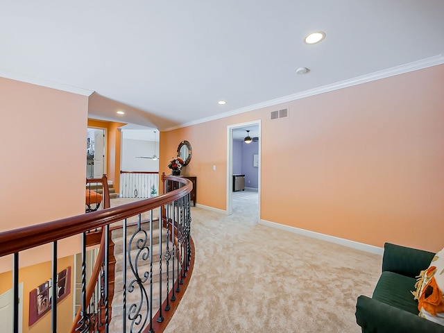 hall featuring light carpet and crown molding