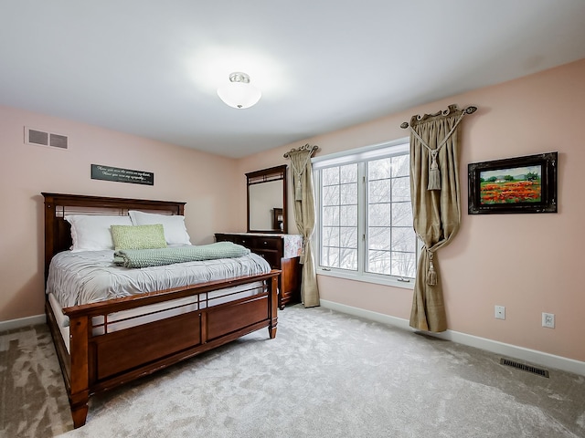 bedroom with light carpet