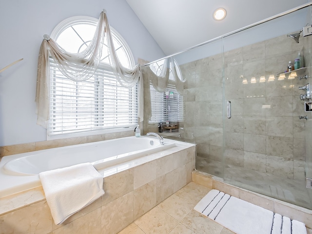 bathroom featuring lofted ceiling, tile patterned floors, and separate shower and tub