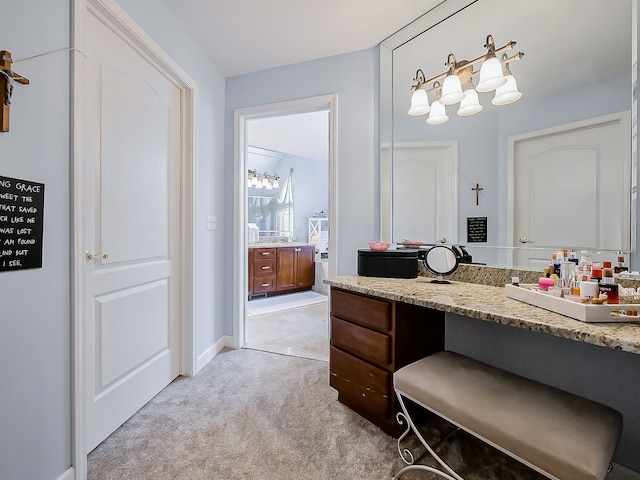 bathroom featuring baseboards and vanity