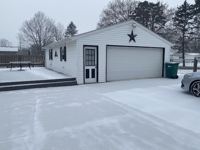 view of snow covered garage