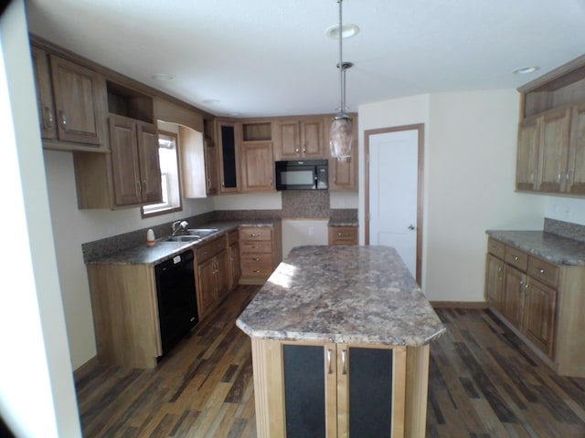 kitchen featuring black appliances, dark wood-style floors, and a center island