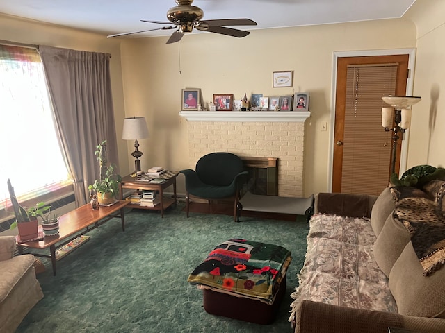 living room featuring ceiling fan, a fireplace, and carpet