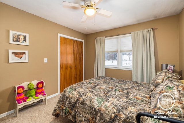 carpeted bedroom featuring ceiling fan and a closet