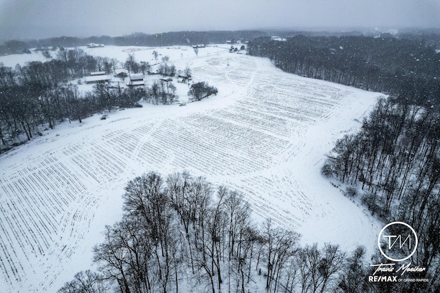 snowy aerial view with a rural view