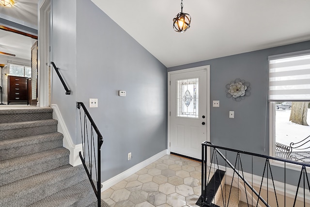 foyer featuring vaulted ceiling