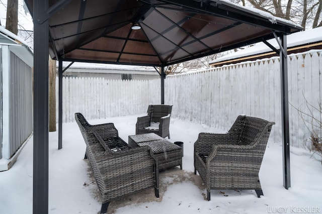 snow covered patio with a gazebo