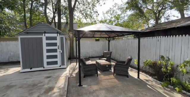 view of patio / terrace with a gazebo, an outdoor living space, and a shed