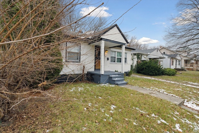 bungalow with a front yard