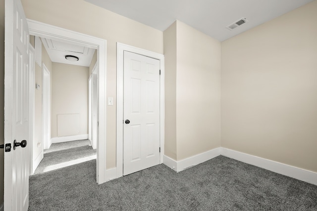 interior space with dark colored carpet