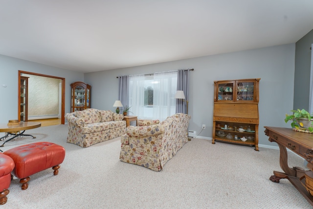 living room with a baseboard radiator and carpet flooring