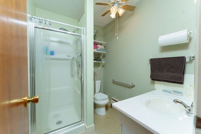 bathroom with vanity, an enclosed shower, baseboard heating, toilet, and a textured ceiling