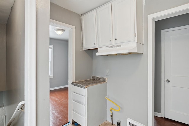 kitchen featuring white cabinets