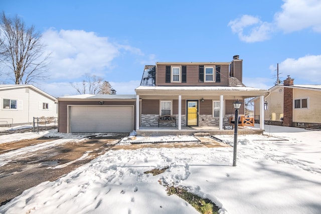 view of front of house with covered porch and a garage