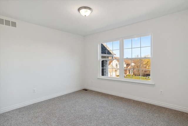 empty room with carpet flooring