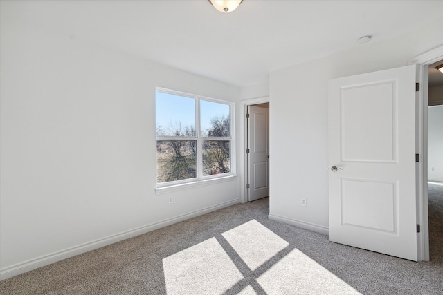 unfurnished bedroom with light colored carpet