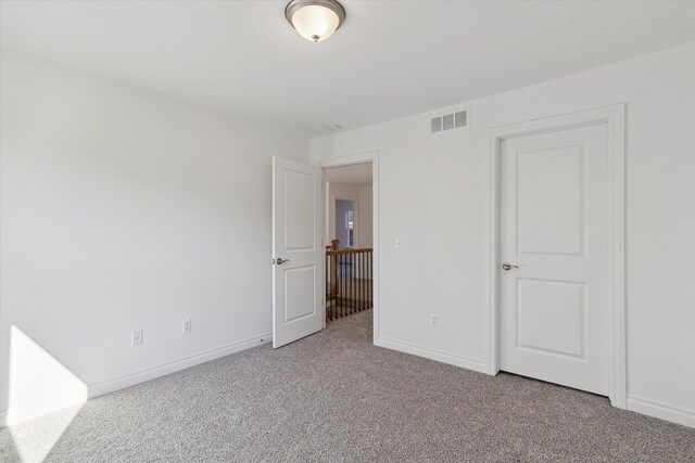 unfurnished bedroom with carpet floors