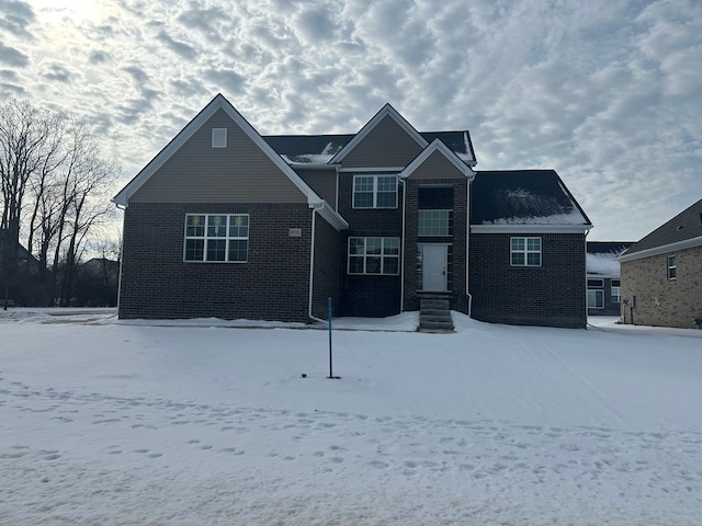 traditional-style home with brick siding