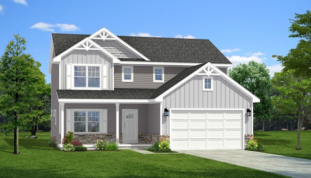 view of front of house featuring a front lawn and a garage