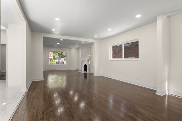 unfurnished living room featuring wood-type flooring