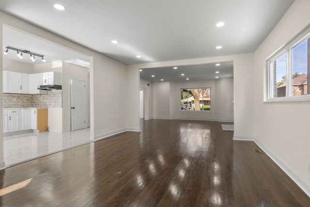 unfurnished living room with hardwood / wood-style flooring