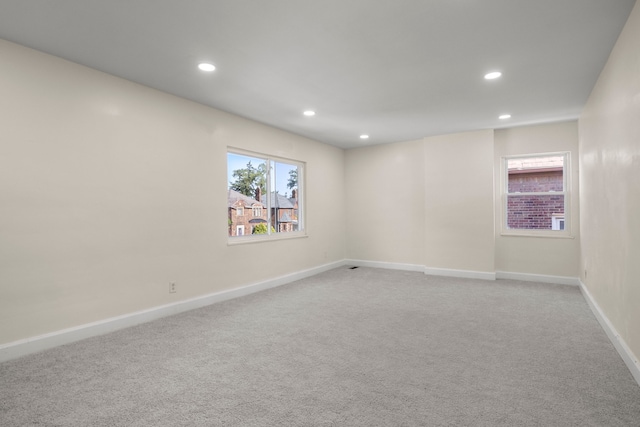 empty room featuring light colored carpet