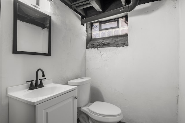 bathroom with toilet and vanity