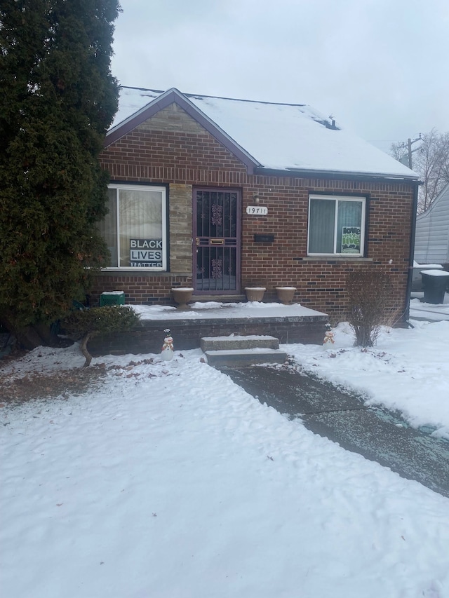 view of front of home with brick siding