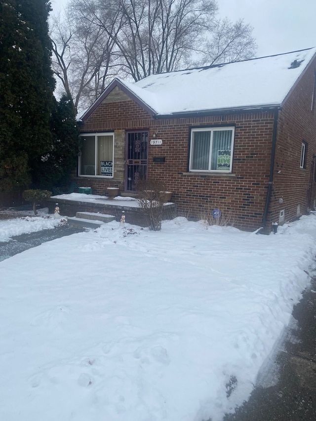 view of front of house featuring brick siding