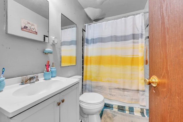 bathroom featuring toilet and vanity