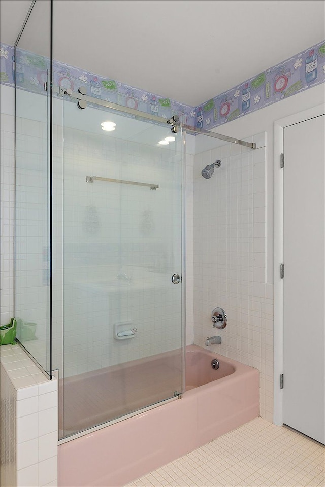 bathroom featuring shower / bath combination with glass door