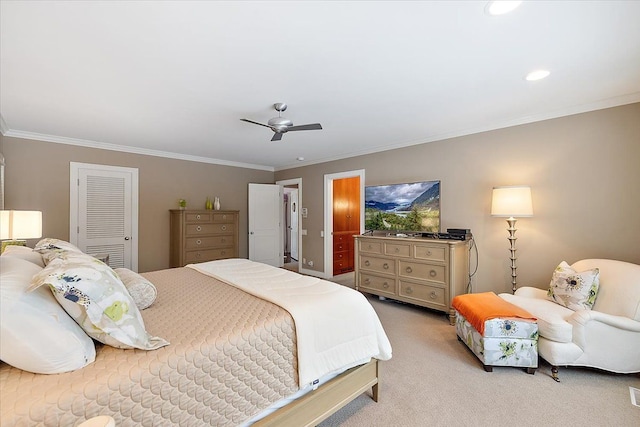 carpeted bedroom with crown molding, a closet, and ceiling fan