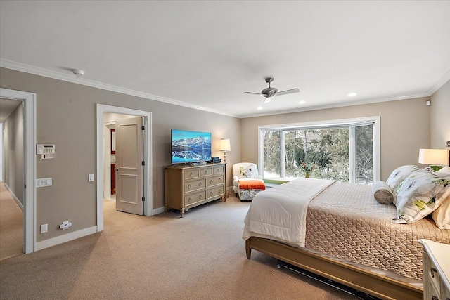 carpeted bedroom featuring ornamental molding and ceiling fan