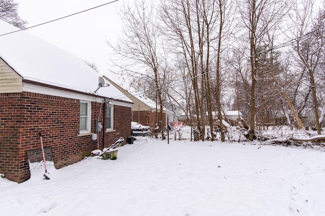 view of yard layered in snow