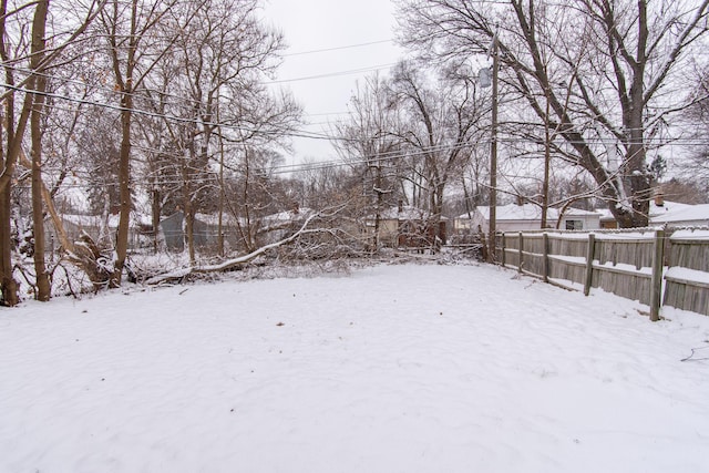 view of yard covered in snow