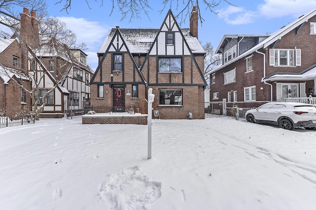 view of snow covered rear of property