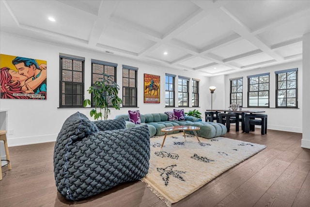 living room featuring hardwood / wood-style flooring, beam ceiling, and coffered ceiling