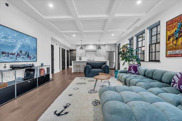 living room with coffered ceiling, beam ceiling, and wood-type flooring