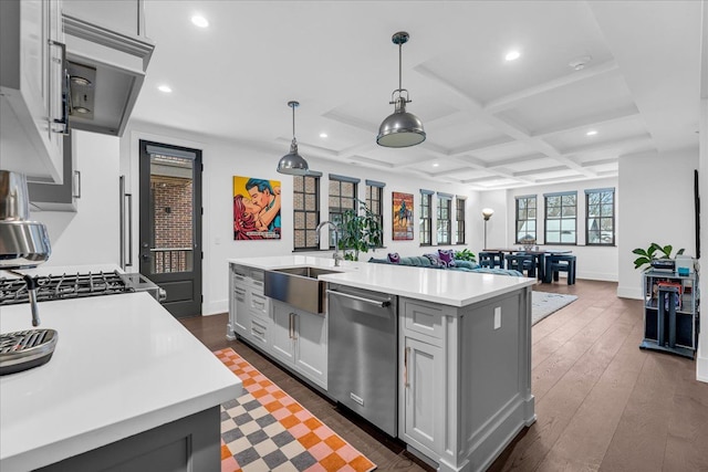 kitchen with coffered ceiling, a sink, light countertops, stainless steel dishwasher, and gray cabinets