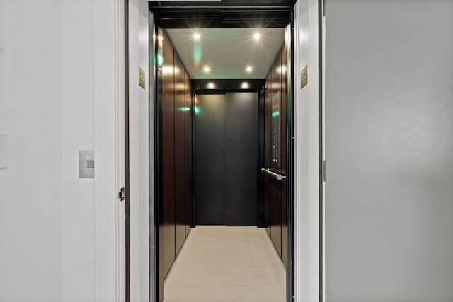 room details featuring elevator and recessed lighting