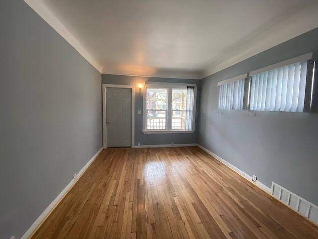 unfurnished room with light hardwood / wood-style floors