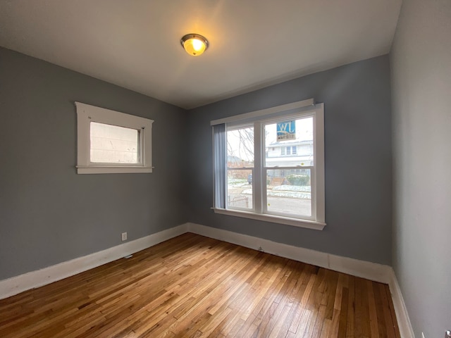 spare room featuring light hardwood / wood-style floors