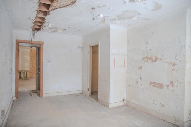 empty room featuring ornamental molding