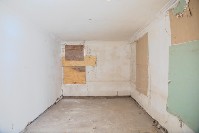 spare room featuring crown molding